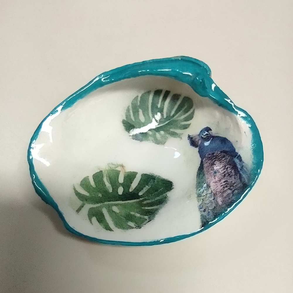 Peacock with palm leaves decoupaged and resin on clam shell